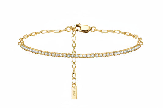 Gold bracelet with a tag and clear stones on a white background, featuring a 'Sterling 925' stamp.