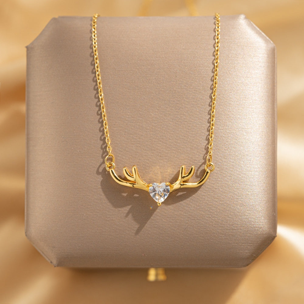 Golden deer antler pendant necklace by Everyday Auraa featuring a minimal elegant charm with a delicate chain and natural antler design.