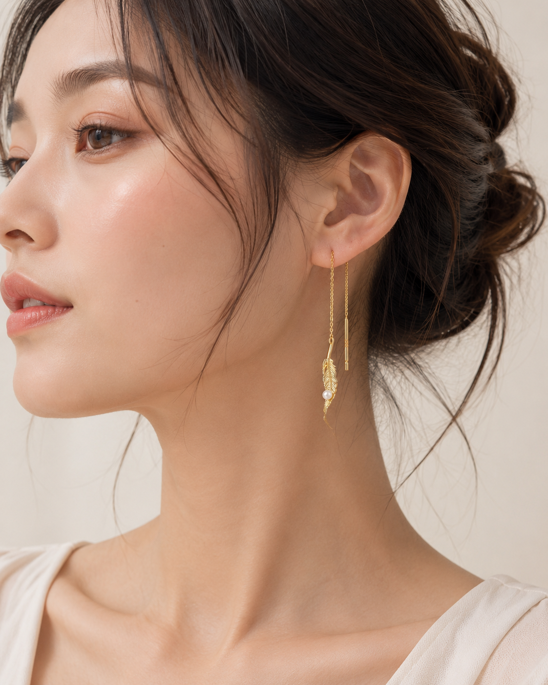 Elegant pearl feather earrings in 925 silver with soft luxury style, featuring delicate feather and pearl design by Everyday Auraa.