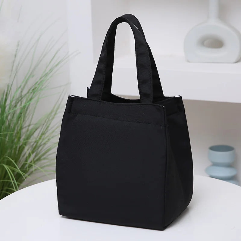 Large capacity insulated lunch bag by Everyday Auraa with aluminum foil thermal lining, top handle, perfect for work and travel.