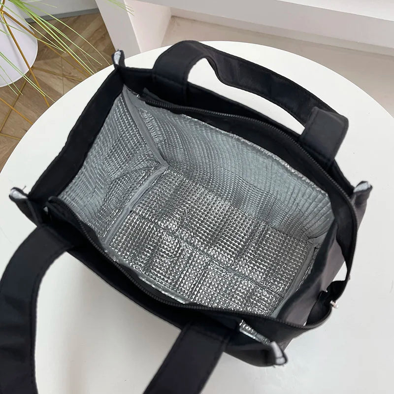 Large insulated lunch bag by Everyday Auraa with aluminum foil thermal lining, top handle, ideal for work and travel food storage.