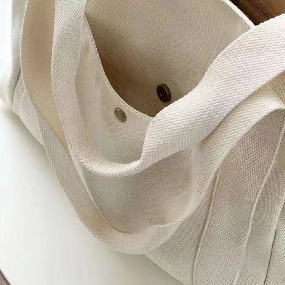 Large beige canvas tote bag by Everyday Auraa, spacious work and shopping shoulder bag with laptop compartment, stylish and durable.