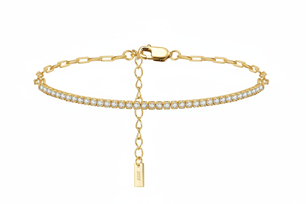 Gold bracelet with a tag and clear stones on a white background, featuring a 'Sterling 925' stamp.