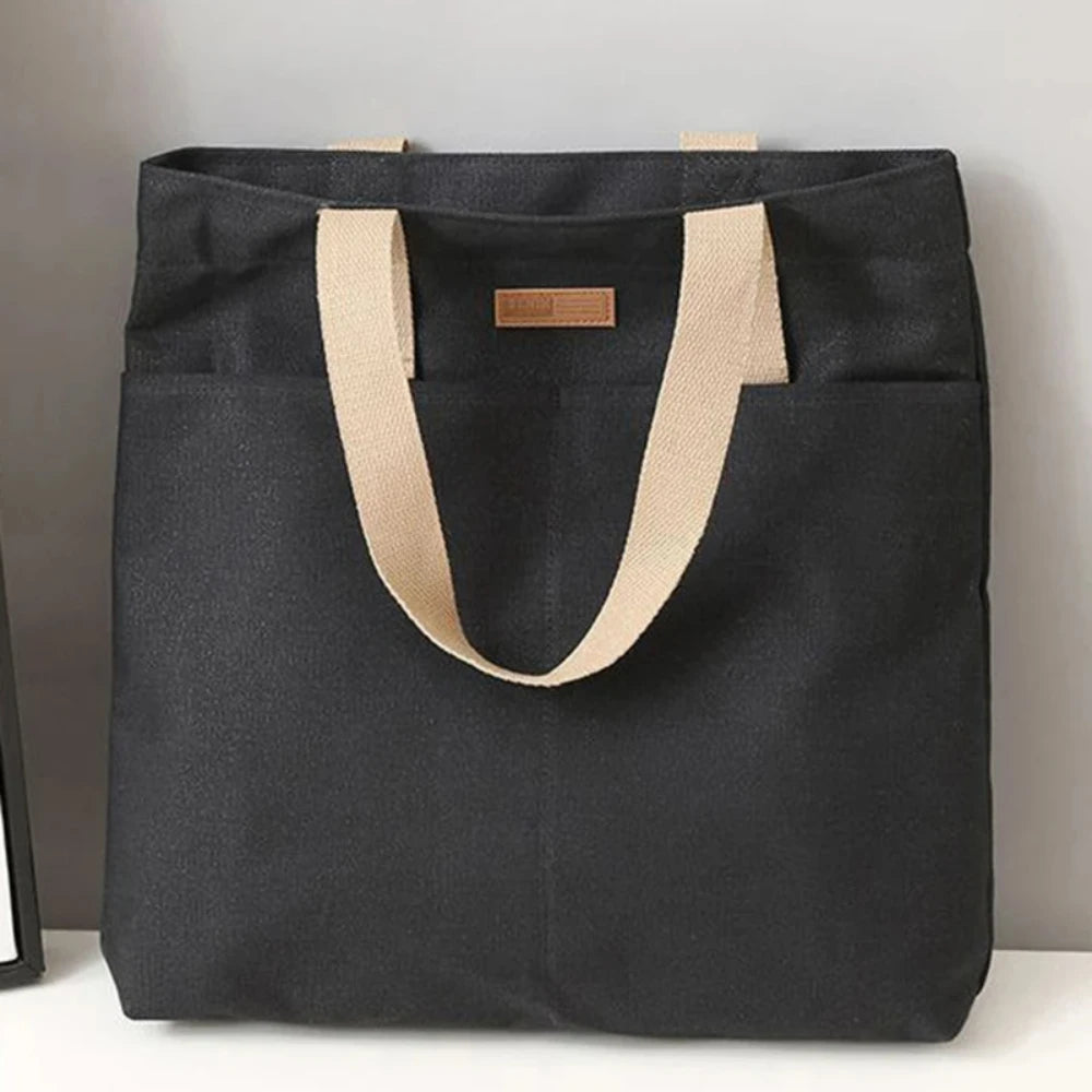 Large capacity canvas tote bag by Everyday Auraa, casual shoulder handbag with multiple compartments for everyday shopping and commuting.