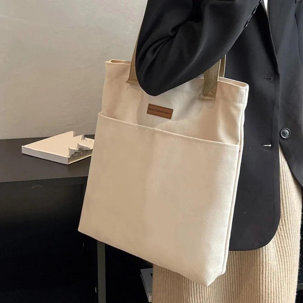 Women’s large capacity canvas tote bag by Everyday Auraa, casual shoulder handbag for shopping and everyday carry.