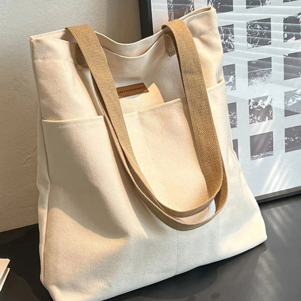 Large capacity canvas tote bag by Everyday Auraa with casual shoulder strap, perfect for shopping and everyday carry.