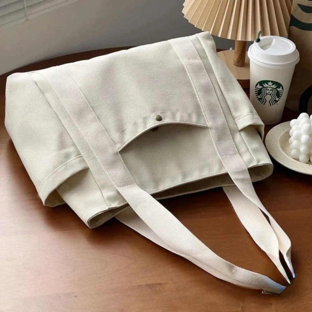 Large beige canvas tote bag by Everyday Auraa with shoulder straps, spacious interior for work, college, shopping, and commuting.
