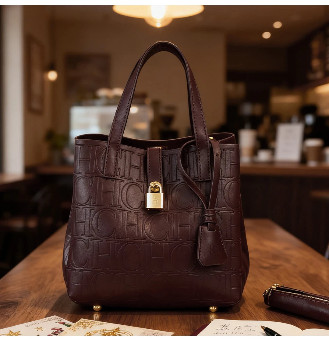 Everyday Auraa women's embossed crossbody tote bag with letter design, large capacity, elegant shoulder purse and handbag.