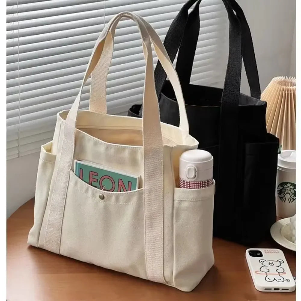 Large capacity canvas tote bag by Everyday Auraa, ideal for work, college, shopping, and carrying laptops or daily essentials.