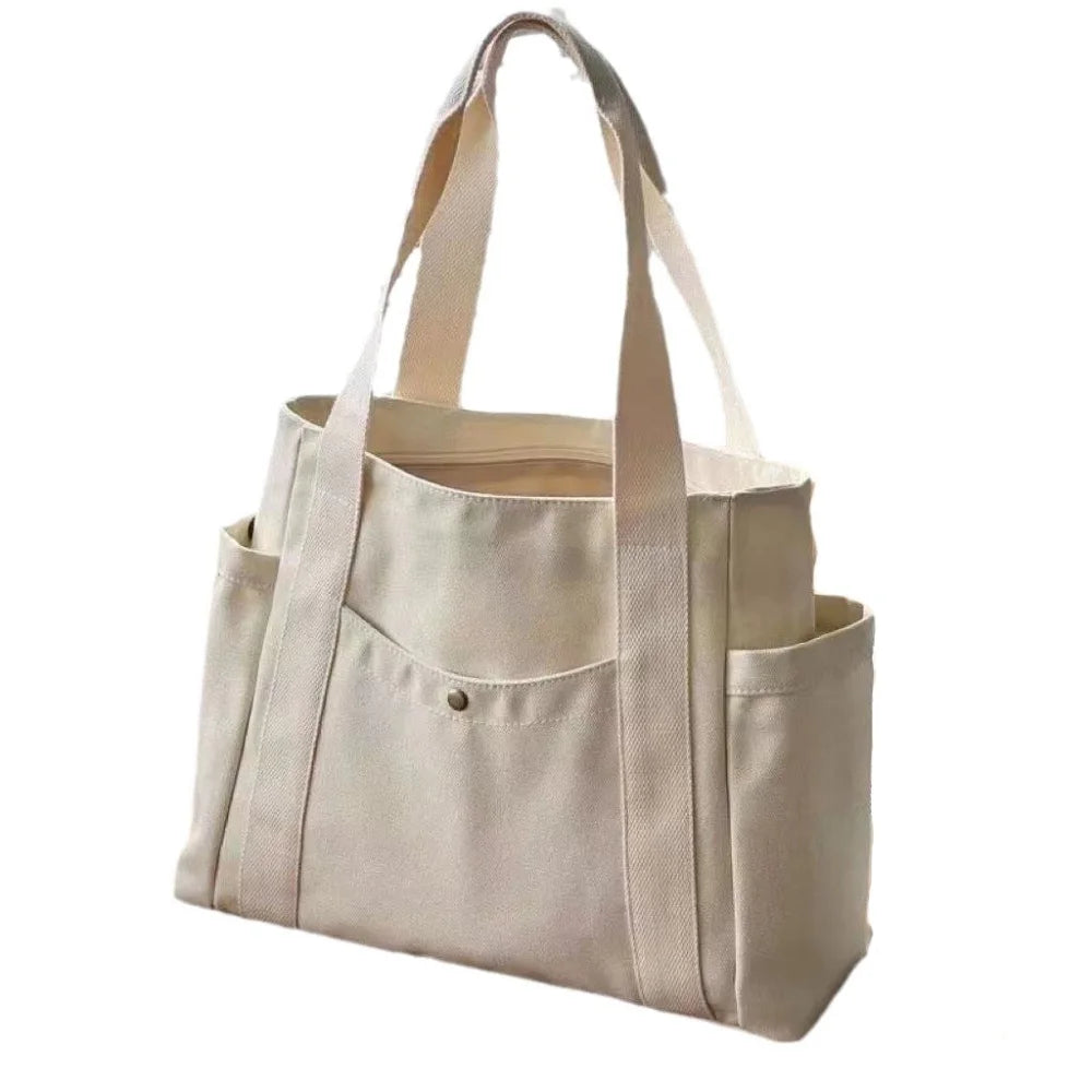 Large capacity canvas tote bag by Everyday Auraa with shoulder straps, ideal for work, college, shopping, and carrying a laptop.