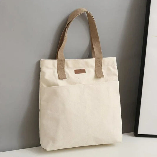Large capacity canvas tote bag by Everyday Auraa, casual shoulder handbag with spacious interior for everyday shopping and commuting.