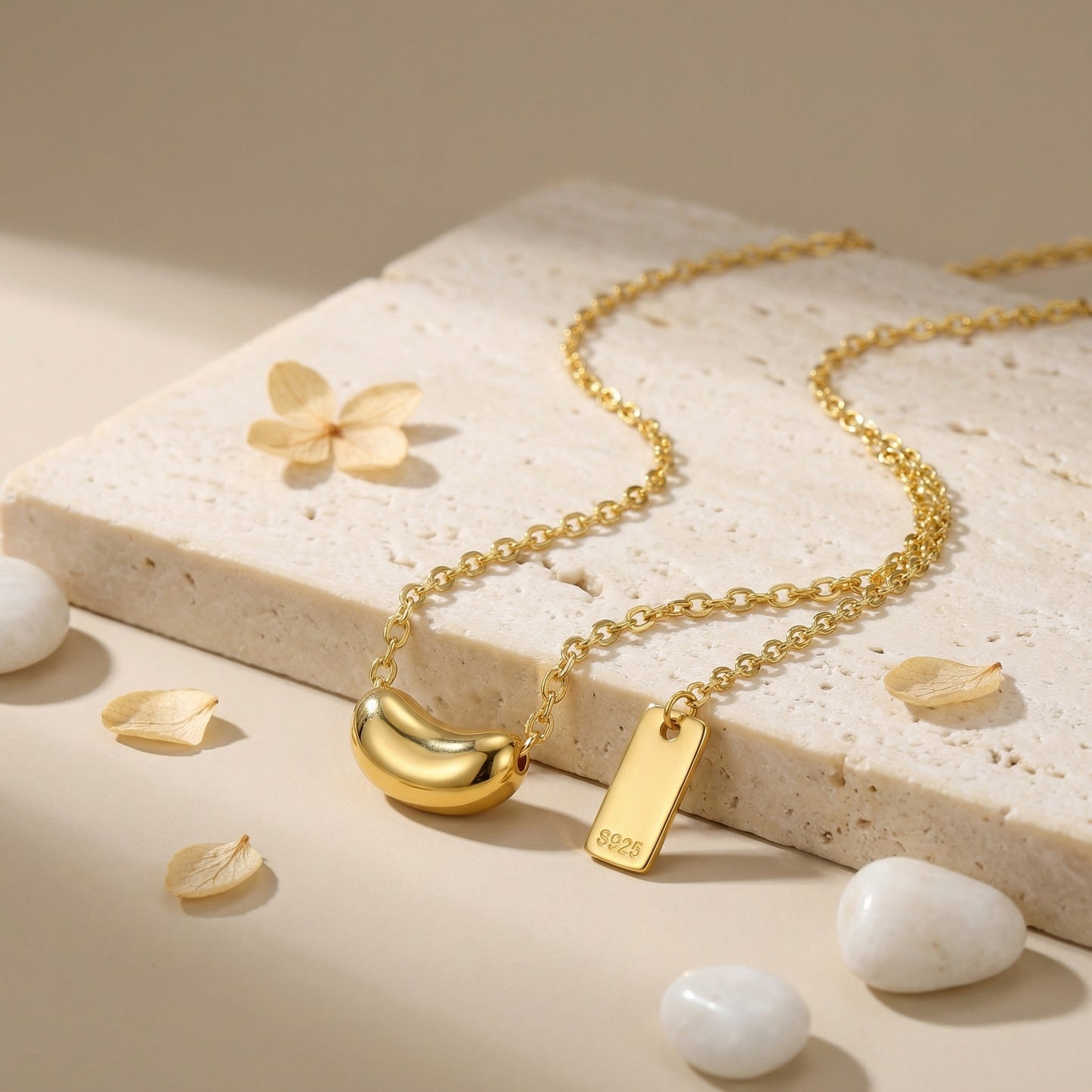 Sterling silver minimalist bean pendant necklace with dainty chain and S925 hallmark tag from Everyday Auraa.